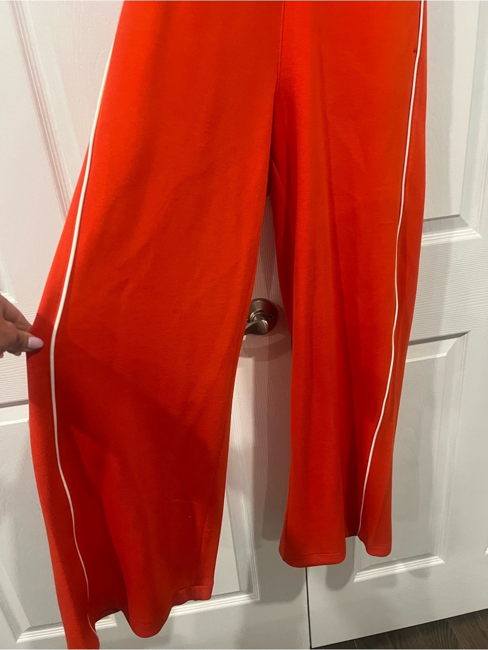 Sleeveless SPANX Air Essentials jumpsuit  in Bright Orange with White Piping - Picture 3 of 6